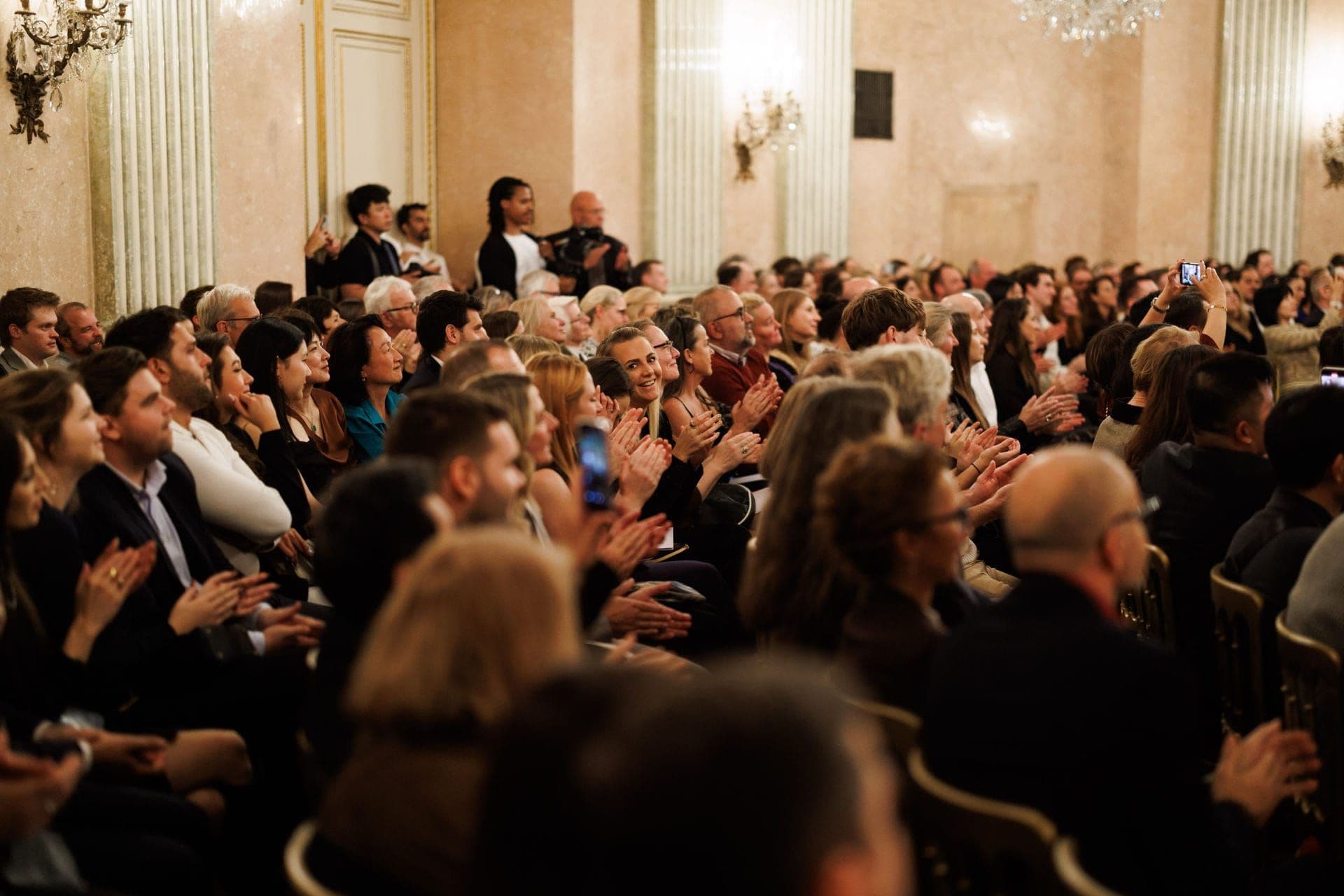 Audience applauding in the concert hall
