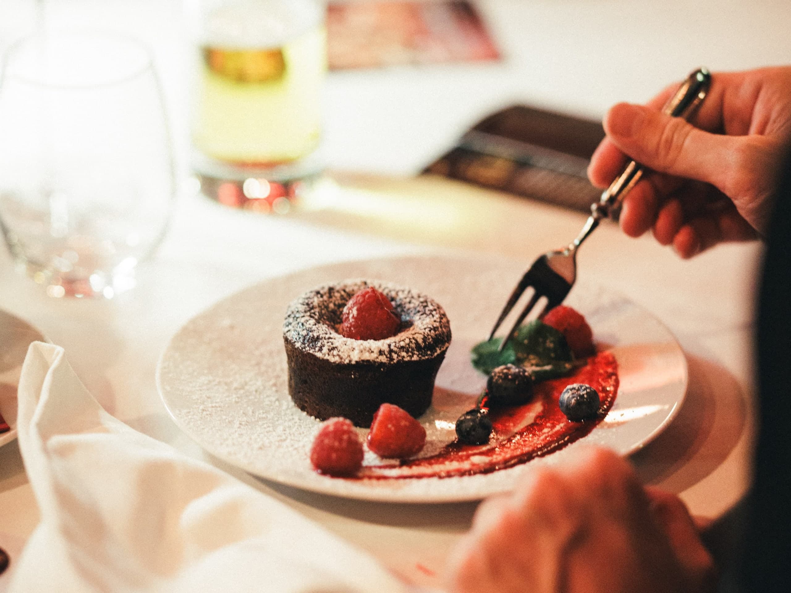 Chocolate lava cake with raspberries and berry sauce