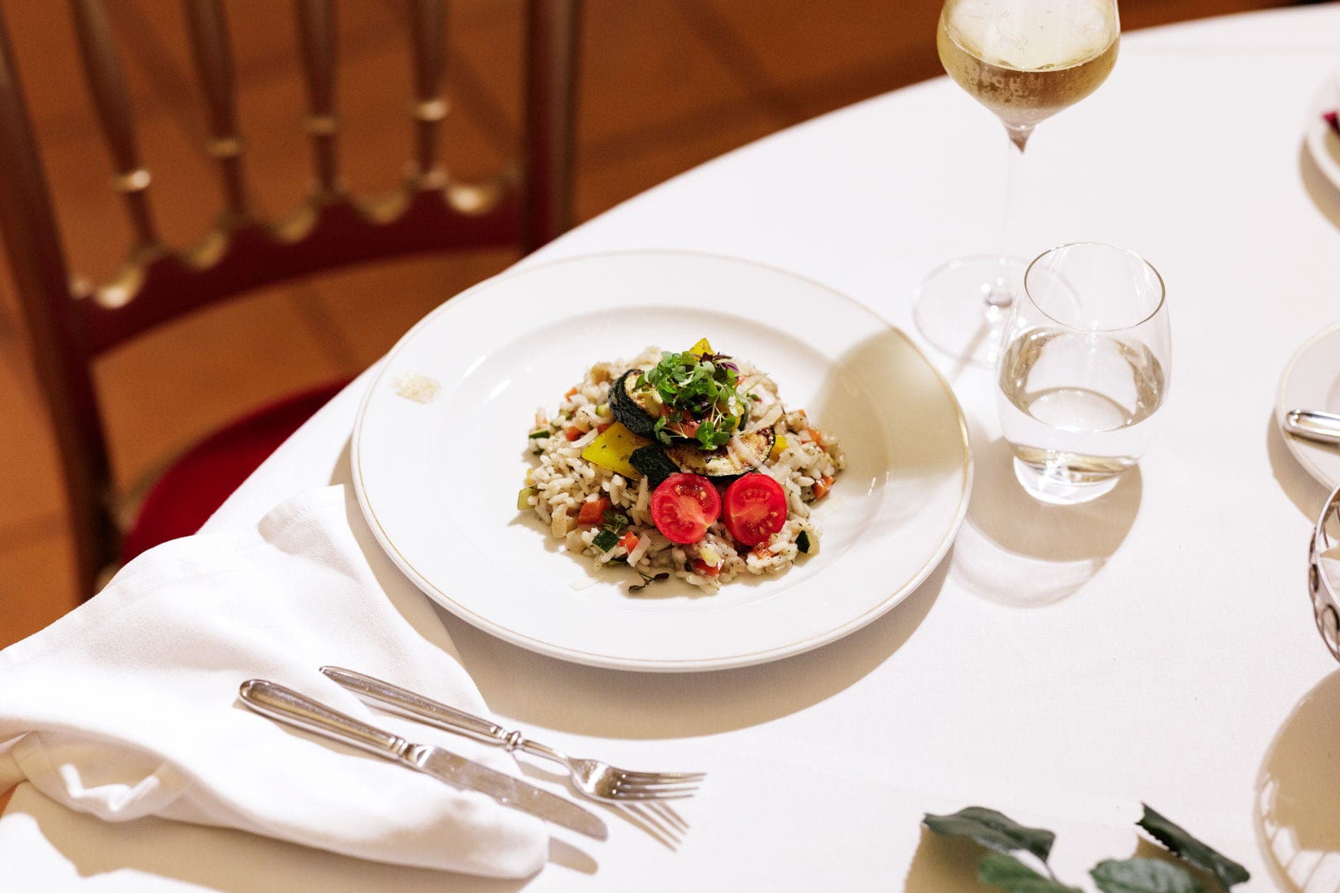 Grain dish with grilled vegetables and tomatoes
